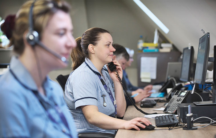 A row of SinglePoint nurses taking calls.