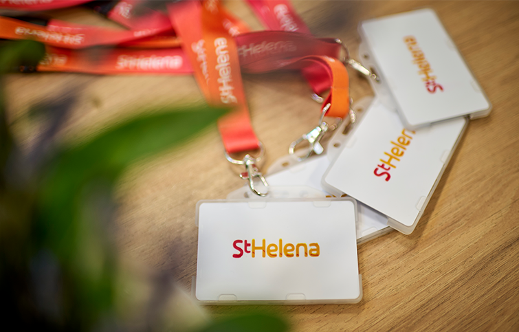 3 St Helena Staff Passes laid out on a table for St Helena Job applicants