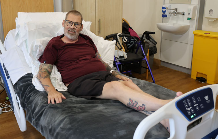 David is in his bed at St Helena Hospice